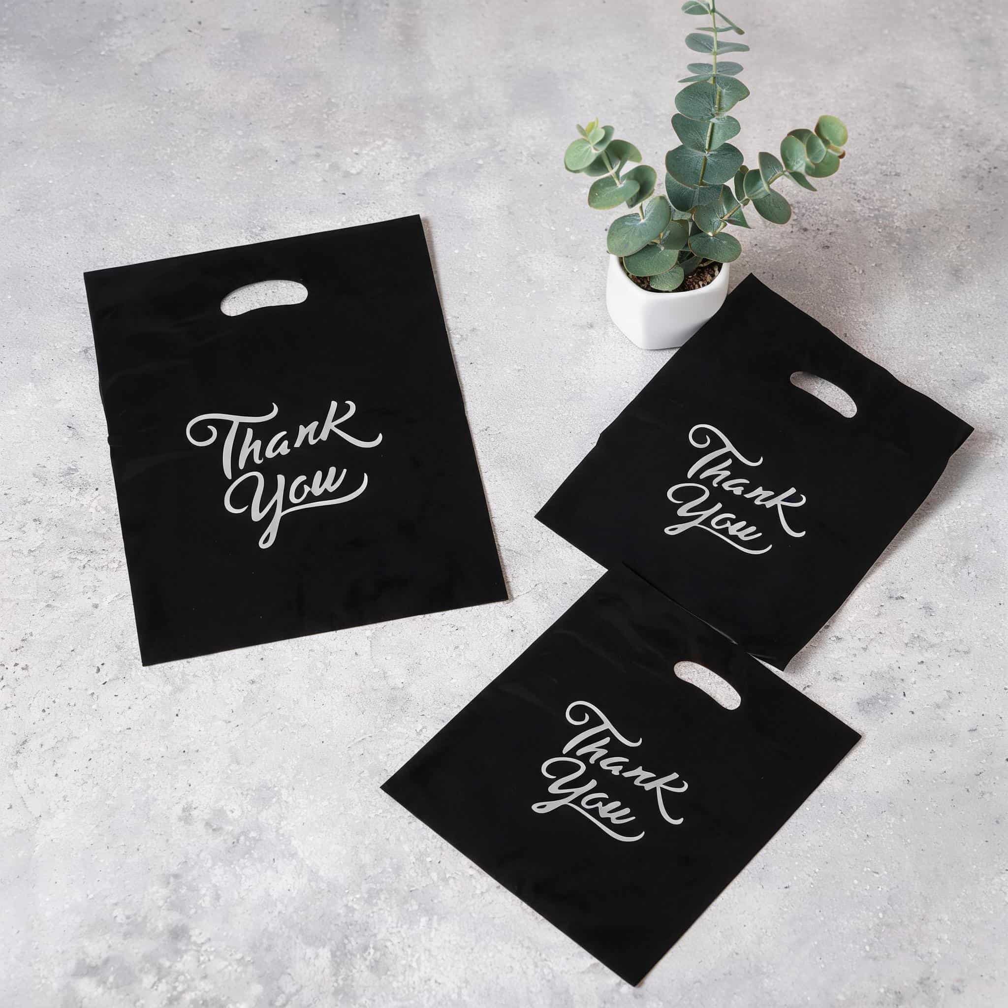 Custom Printed Frosted Black Die Cut Handle Merchandise Bags